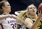 Baylor forward Lauren Cox (15) pulls in a rebound next to Kansas center Bailey Helgren (35) during the second half of an NCAA college basketball game in Lawrence, Kan., Wednesday, Jan. 15, 2020. (AP Photo/Orlin Wagner)