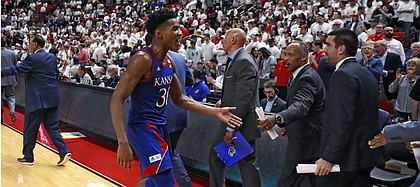Kansas' Ochai Agbaji (30) celebrates after an NCAA college basketball game against Texas Tech, Saturday, March 7, 2020, in Lubbock, Texas. (AP Photo/Brad Tollefson)