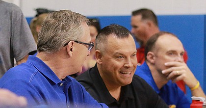 Kansas Athletic Director Jeff Long (left) cheers on the KU volleyball team on Sunday, Aug. 26, 2018, while sitting with women's basketball coach Brandon Schneider.