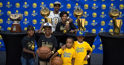 Former Kansas point guard Aaron Miles' and his family, shown here after the Golden State Warriors' NBA title in 2018, have enjoyed being a part of the Warriors' recent success.