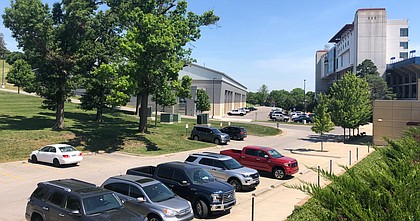 Cars fill the parking lots at the Kansas football facilities on Monday, June 15, 2020, the first day allowed by Big 12 Conference guidelines for football players to return to campus for voluntary workouts in the wake of the COVID-19 pandemic.