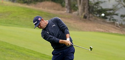 Gary Woodland watches his shot on the 14th hole during the first round of the PGA Championship golf tournament at TPC Harding Park Thursday, Aug. 6, 2020, in San Francisco. (AP Photo/Charlie Riedel)