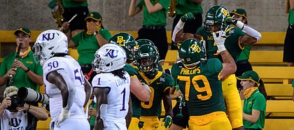 Sep 26, 2020; Waco, Texas, USA; Baylor Bears running back John Lovett (7) celebrates scoring a touchdown against the Kansas Jayhawks during the second half at McLane Stadium. Mandatory Credit: Jerome Miron-USA TODAY Sports