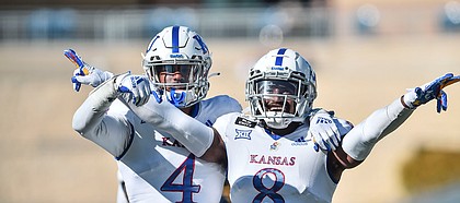 Kansas cornerbacks Elijah Jones and Kyle Mayberry react after breaking up a pass against West Virginia on Saturday, Oct. 16, 2020, in Morgantown, W.Va.