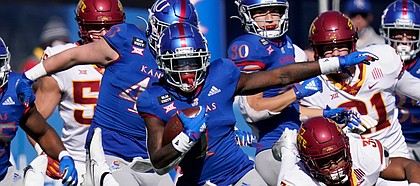 Kansas return specialist Kenny Logan Jr. (1) breaks away from Iowa State defenders Gerry Vaughn (32) and Vonzell Kelley III (29) for a 100-yard touchdown kickoff return during the second half of an NCAA college football game in Lawrence, Kan., Saturday, Oct. 31, 2020. (AP Photo/Orlin Wagner)