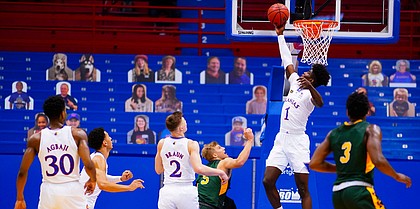 Kansas guard Tyon Grant-Foster (1) rejects a shot from North Dakota State Bison forward Grant Nelson (4) with seconds remaining in regulation on Saturday, Dec. 5, 2020 at Allen Fieldhouse.