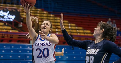 KU senior Julie Brosseau, a graduate transfer from Canada, goes in for two of her game-high 25 points during the Jayhawks' 100-59 win over Oral Roberts on Sunday, Dec. 6, 2020, at Allen Fieldhouse.