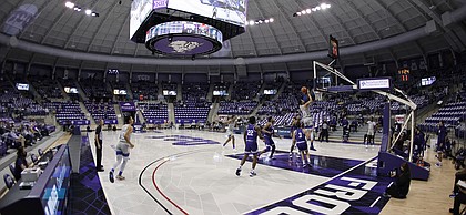 Kansas guard Tristan Enaruna (13) shoots as TCU guards RJ Nembhard (22) and Francisco Farabello (3) watch euring the first half of an NCAA college basketball game in Fort Worth, Texas, Tuesday, Jan. 5, 2021. (AP Photo/Ron Jenkins)