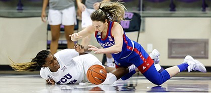 Kansas guard Julie Brosseau dives to the floor after a loose ball against TCU in Schollmaier Arena in Fort Worth, Texas, on Jan. 17, 2021 (Photo/Gregg Ellman )