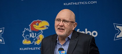 Kansas football offensive coordinator and quarterbacks coach Mike DeBord answers questions during his introductory press conference on Feb. 3, 2021.