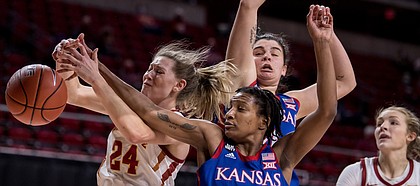 Kansas guard Aniya Thomas battles for a rebound against Iowa State on March 3, 2021, at Hilton Coliseum, in Ames, Iowa.