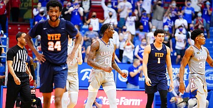 Kansas guard Marcus Garrett (0) clenches his fist after the Jayhawks' pulled off a 67-62 comeback win over UTEP on Thursday, March 4, 2021 at Allen Fieldhouse.
