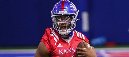 Kansas quarterback Jalon Daniels runs the ball during the Jayhawks' first spring practice, on March 30, 2021.