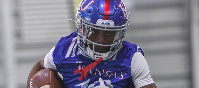 Kansas receiver Steven McBride runs through a drill during a spring practice at the Jayhawks' indoor facility on March 30, 2021.