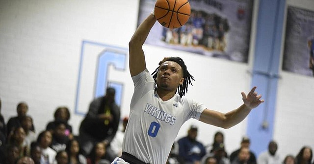 New Kansas basketball signee Bobby Pettiford Jr., soars through the air for a bucket during his playing days at South Granville High. 