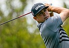Gary Woodland watches his tee shot on the second hole during the third round of the Wells Fargo Championship golf tournament at Quail Hollow on Saturday, May 8, 2021, in Charlotte, N.C. 


