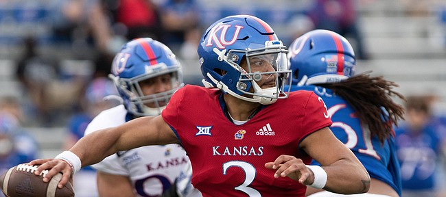 Redshirt senior quarterback Miles Kendrick throws the ball from the pocket in the Kansas Football Spring Game. The White team defeated the Blue team 74-42 Saturday, May 1, 2021.