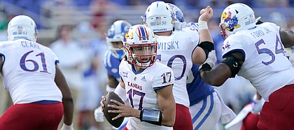 Kansas quarterback Jason Bean (17) scrambles against Duke during the first half of an NCAA college football game in Durham, N.C., Saturday, Sept. 25, 2021. (AP Photo/Gerry Broome)