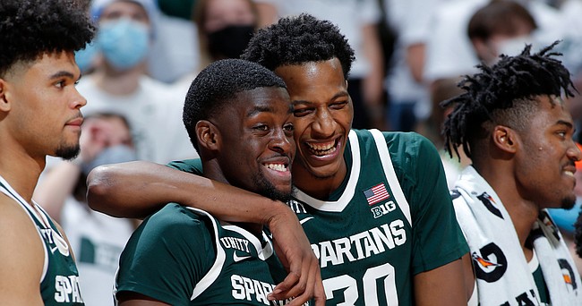 Michigan State's Gabe Brown (44) and Marcus Bingham Jr. react during an NCAA college basketball exhibition game against Grand Valley State, Thursday, Nov. 4, 2021, in East Lansing, Mich. Michigan State won 83-60.