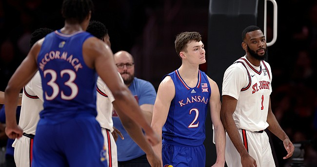 Kansas guard Christian Braun (2) reacts after being fouled by St. John's forward Aaron Wheeler (1) during the second half of an NCAA college basketball game Friday, Dec. 3, 2021, in Elmont, N.Y. Kansas won 95-75. (AP Photo/Adam Hunger)



