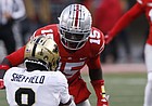 In this file photo, former Ohio State linebacker Craig Young, top, and linebacker Steele Chambers, bottom, tackle Purdue receiver TJ Sheffield during the first half of an NCAA college football game, Saturday, Nov. 13, 2021, in Columbus, Ohio. Young announced on Dec. 13, 2021, he will transfer to play at Kansas. (AP Photo/Jay LaPrete)


