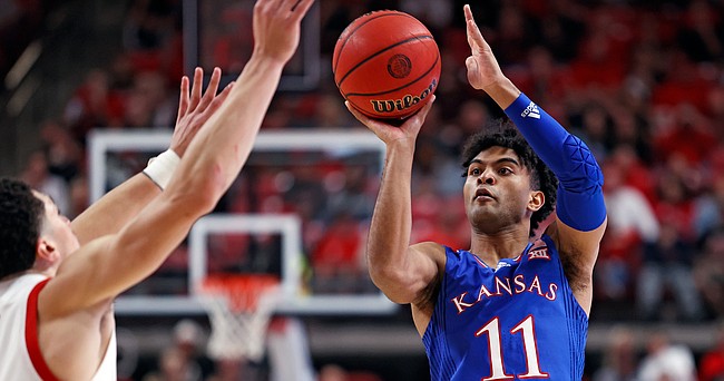 Kansas' Remy Martin (11) shoots the ball during the second half of an NCAA college basketball game against Texas Tech, Saturday, Jan. 8, 2022, in Lubbock, Texas. (AP Photo/Brad Tollefson)


