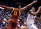 Kansas guard Ochai Agbaji (30) ducks under Iowa State Cyclones guard Tyrese Hunter (11) for a bucket during the second half on Tuesday, Jan. 11, 2022 at Allen Fieldhouse.