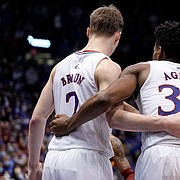 The Jayhawks come together before a couple of free throws from Kansas guard Ochai Agbaji (30) with seconds remaining in the second half on Tuesday, Jan. 11, 2022 at Allen Fieldhouse.