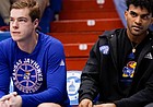 Kansas guard Remy Martin, right, sits on the bench with an injury next to reserve guard Michael Jankovich during the second half on Saturday, Jan. 1, 2022 at Allen Fieldhouse.