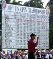 Tiger Woods celebrates on the 18th green after winning the 100th
U.S. Open Golf Championship at the Pebble Beach Golf Links in
Pebble Beach, Calif., Sunday, June 18, 2000.