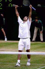 Pete Sampras celebrates as he defeats Australias Patrick Rafter in
the singles final Sunday on Centre Court at Wimbledon. Sampras won
the final 6-7 (10-12), 7-6 (7-5), 6-4, 6-2.