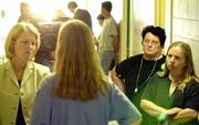 As her daughter, Heidi Bledsoe, speaks with the media in the hallway of Oskaloosas Jefferson County Courthouse, Tommie Sue Arfmann, second from right, listens. At right is Bledsoe's sister, Rose Anna Erhart. Bledsoes husband, Floyd S. Bledsoe, was sentenced to life in prison Friday for the November 1999 murder of 14-year-old Camille Arfmann.