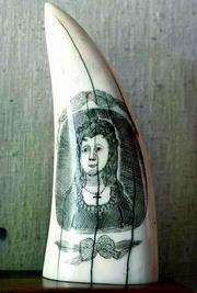 An image of a woman carved into a whale's tooth is an example of
19th-century scrimshaw on display at the Nantucket Whaling Museum.