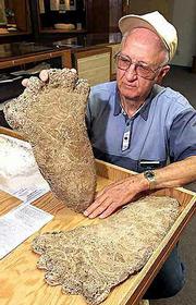 Al Hodgson, a volunteer guide at the Willow Creek-China Flat
Museum, holds up a plaster cast of a Bigfoot imprint.