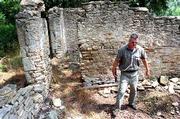 With the help of a state grant, the remains of a stone building
near the Wakarusa River will be studied to determine their
historical significance. The building was located near what was
known as Blanton&squot;s Bridge, which may have been used by the likes of
John Brown, Quantrill&squot;s raiders and many less notorious visitors to
Lawrence as an important gateway to the city from 1854 to 1866.
"You could say this is where Bleeding Kansas began," said Karl
Gridley, above, a stone mason and historian.