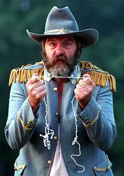 Don McIntyre portrays Bill Anderson in "Voices in the Dawn," a play
about the survivors of William Quantrill&squot;s raid on Lawrence.
Anderson is a Missourian who joined William Quantrill&squot;s army to
avenge the deaths of his father, who was killed after being
convicted of horse stealing in Council Grove, and his sisters, who
were taken prisoner by Kansans.