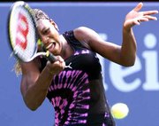 Serena williams returns a shot to Tina Pisnik. Williams was a 6-3,
6-2 winner Tuesday in the U.S. Open.