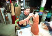 Lawrence artist Barry Coffin works on a piece in his studio in
downtown Lawrence. Coffin is one of the judges for this year's
Lawrence Indian Arts Show at the Museum of Anthropology.