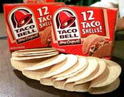 Packages of Taco Bell taco shells are displayed at a news
conference in Montpelier, Vt. On Friday, Kraft Foods recalled the
shells sold in supermarkets after tests confirmed they were made
with corn that isn't approved for human consumption.
