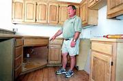 Lawrence home builder Ron Durflinger is taking a new approach with
housing construction. He's starting to add features that appeal to
both an aging population and people with disabilities. In a house
being built on Harvard Road, the kitchen features lowered cabinets
and a sink that can be adapted to wheelchair use. Some cabinets
also have pull-out shelves for easy access.