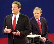 Democratic presidential candidate Vice President Al Gore, left,
makes a point under the watchful eye of Republican presidential
candidate Texas Gov. George W. Bush. The two on Tuesday were
participating in their third and final debate at Washington
University in St. Louis.