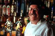 Novelist and restaurateur Carlos Haro, in the tequila bar at his
Casablanca Mexican restaurant, has written a Spanish-language book,
"Tequila." The book is infused with foods and flavors of the
Mexican town that is the center of tequila production for Jalisco.