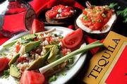 Tequila is a driving force in these dishes adding flavor as well as
character. Clockwise from lower left: Ceviche Tostada, Strawberry
Bunuelos, Shrimp With Coconut.