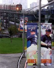 A New York City Subway No. 7 train pulls into the Willets
Point-Shea Stadium station Wednesday outside of Shea Stadium. The
Mets and Yankees will meet when the World Series starts Saturday at
Yankee Stadium.