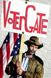 A protester airs his views on the presidential election snafu
outside the governor's mansion in Austin, Tex. Three days after the
election, even Democrats began to suggest that Al Gore's options
were dwindling, although ballot recounts will continue today in
Florida.