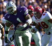 Kansas State's Josh Scobey (1) outruns Iowa State's Justin Eilers
(48) last Saturday in Manhattan. The Wildcats face a bigger test
today when they play host to Nebraska.