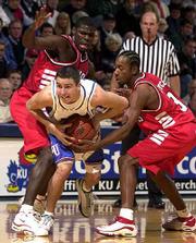 Brett Ballard splits Illinois State defenders Randy Rice, left, and
Ishmael Joyce. Kansas coach Roy Williams' decision to bench the
starters early Thursday meant early floor time for backups like
Ballard.