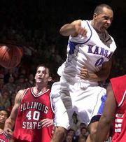 Kansas' Drew Gooden (0) celebrates a second-half score in front of
the Redbirds' Rich Beyers. Gooden whooped it up Thursday at Allen
Fieldhouse.