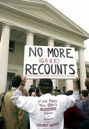 A protester lets his opinion be known regarding the Florida Supreme
Court's decision in the recount of Florida presidential ballots. In
a major boost to Al Gore's bid to the presidency, the Florida
Supreme Court on Friday ordered the recount of tens of thousands of
disputed ballots in the Sunshine State.