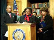 Members of the Black Caucus, Rep. Elijah Cummings, D-Md., left,
Rep. Carrie Meek, D-Fla., center, and Rep. Corrine Brown, D-Fla.,
walked out of the ceremony on Capitol Hill in protest of the
results that gave the presidential election to Texas Gov. George W.
Bush over Vice President Al Gore.